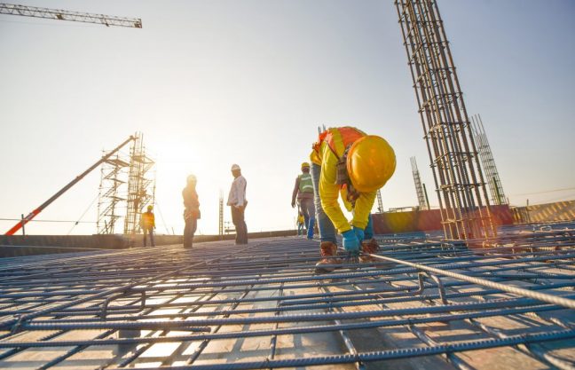 construction-workers-fabricating-steel-reinforcement-bar-construction-site-min construction-workers-fabricating-steel-reinforcement-bar-construction-site-min