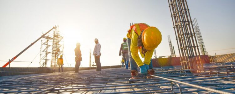 construction-workers-fabricating-steel-reinforcement-bar-construction-site-min