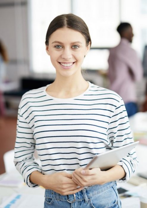 contemporary-young-woman-posing-office-min