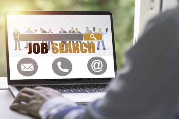 new-graduate-using-laptop-look-online-new-job-search-from-head-hunters-website-recruitment-concept-min